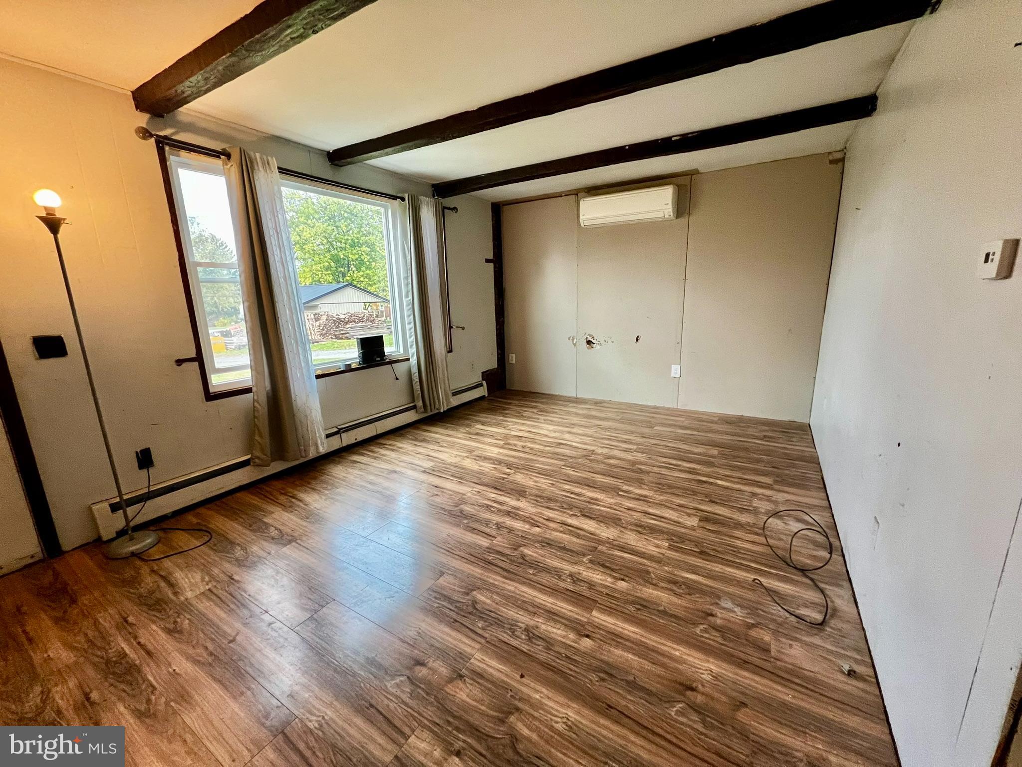 8690 Highway 25 Spring Glen, PA 17978 - Photo 18 of 31 a view of a room with wooden floor and a window