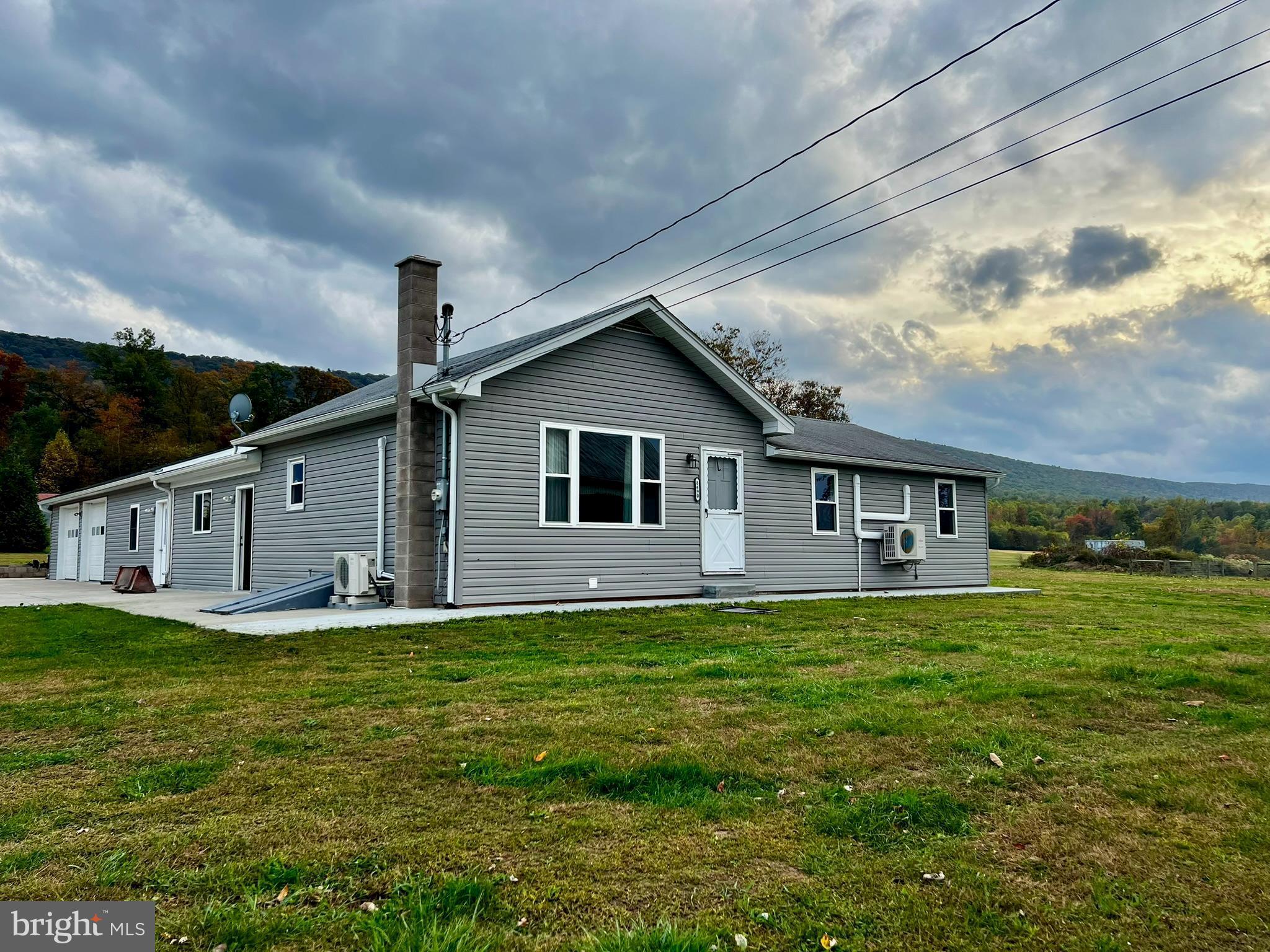 8690 Highway 25 Spring Glen, PA 17978 - Photo 2 of 31 a view of a house with a yard