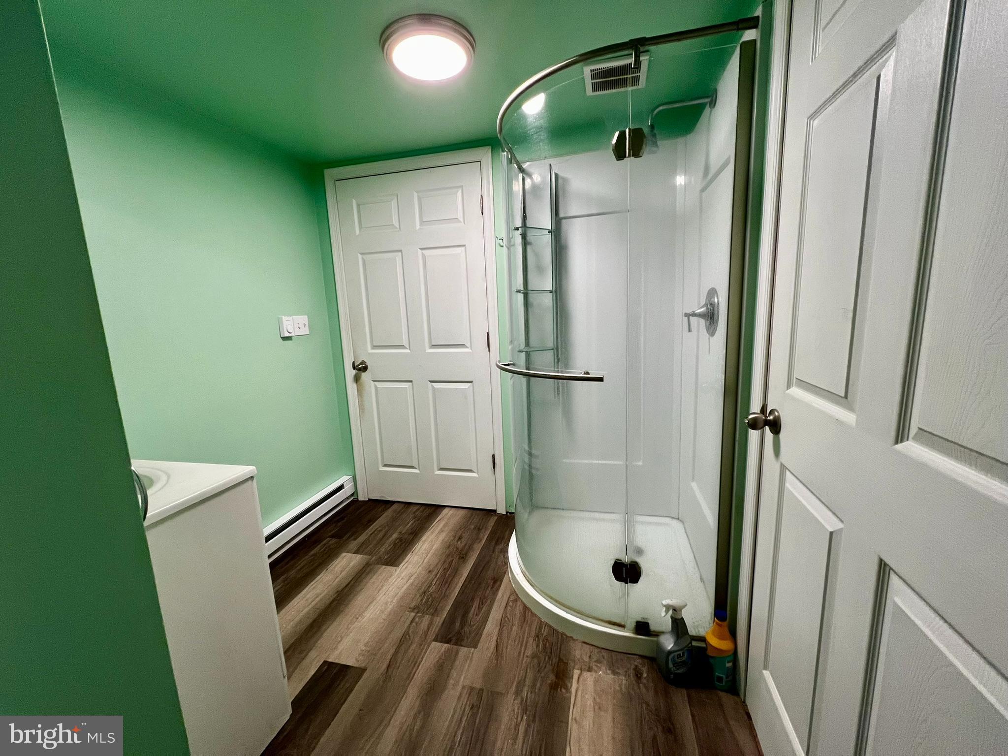 8690 Highway 25 Spring Glen, PA 17978 - Photo 27 of 31 a bathroom with a sink a toilet and shower