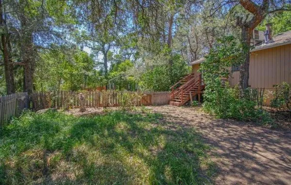 a backyard of a house with lots of green space