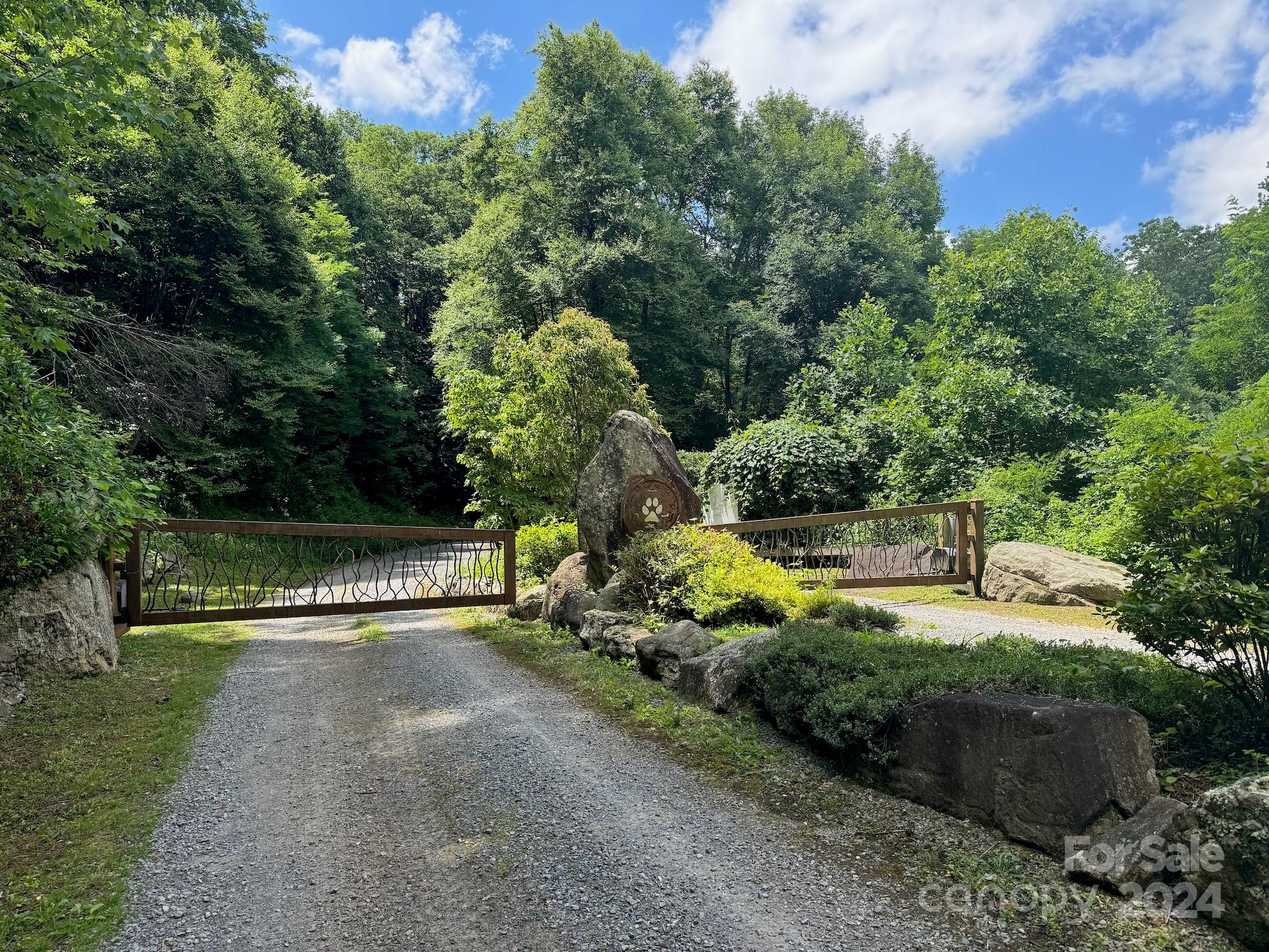 35 Flying Hawk Way Clyde, NC 28721 - Photo 2 of 22 a view of street with grass and trees
