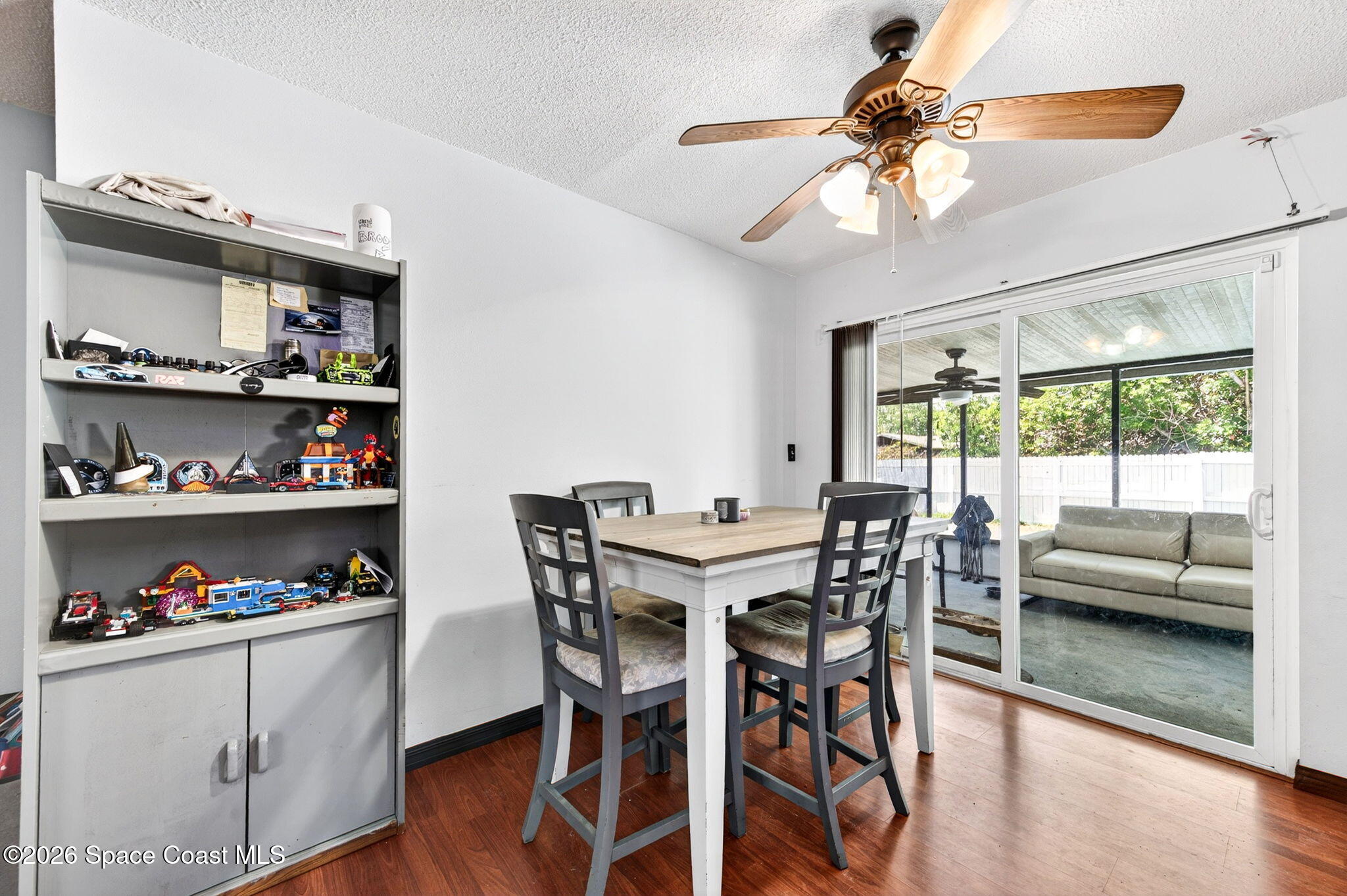 3300 Argyle Road Titusville, FL 32796 - Photo 13 of 29 a view of a dining room with furniture a chandelier and wooden floor