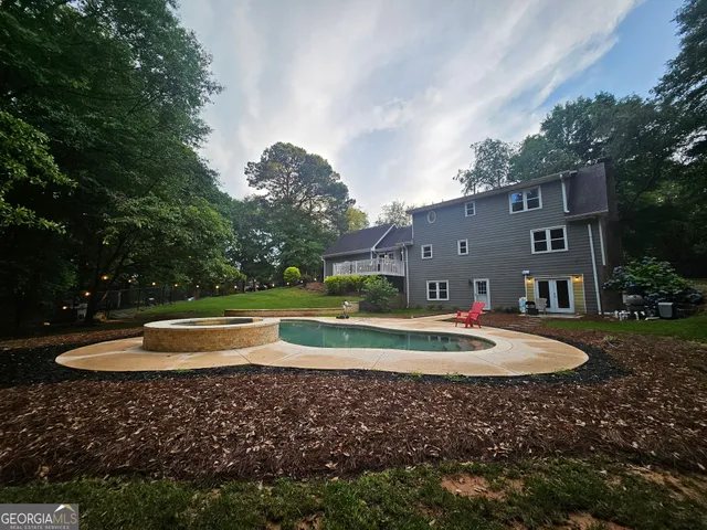 a view of a chair and table in the balcony