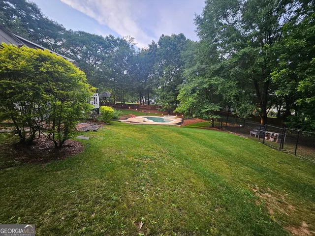 a bedroom with a bed and a ceiling fan