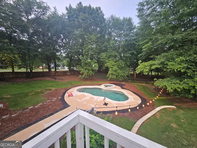 a bathroom with a tub and shower