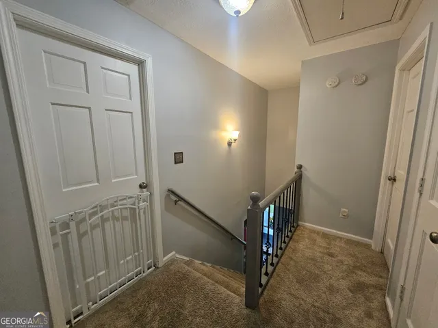 a bedroom with a bed couch and window