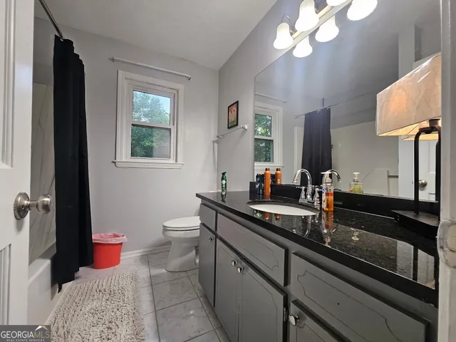 a bedroom with bed and a walk in closet