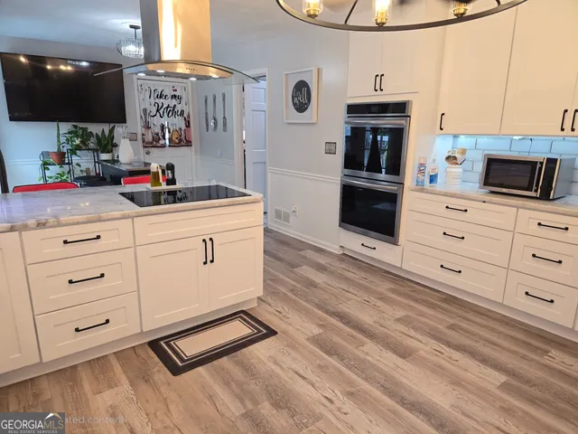 a bed sitting in a bedroom and dresser