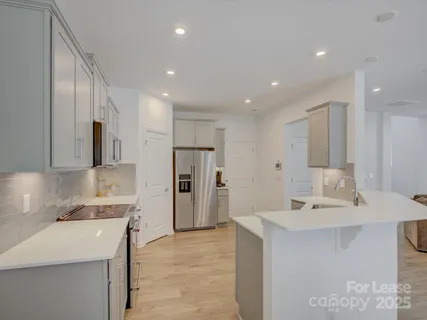 a bathroom with a sink a mirror and a shower