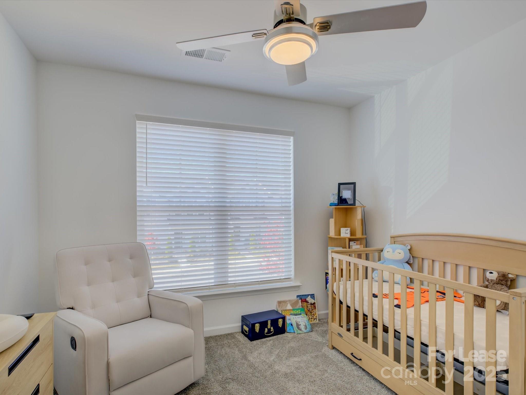 13124 Rover Street Charlotte, NC 28273 - Photo 23 of 46 a bedroom with furniture and a window