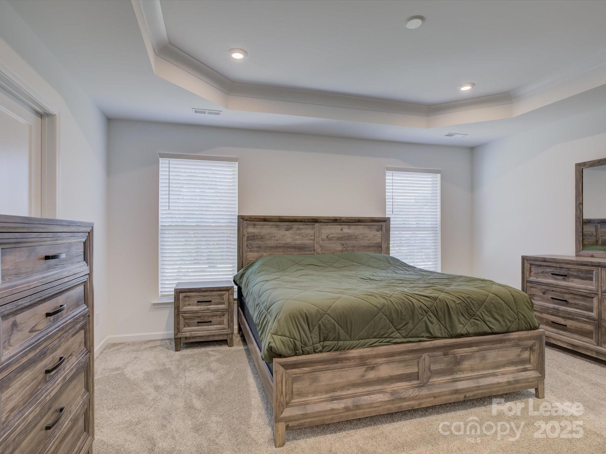 13124 Rover Street Charlotte, NC 28273 - Photo 29 of 46 a bedroom with a bed and dresser