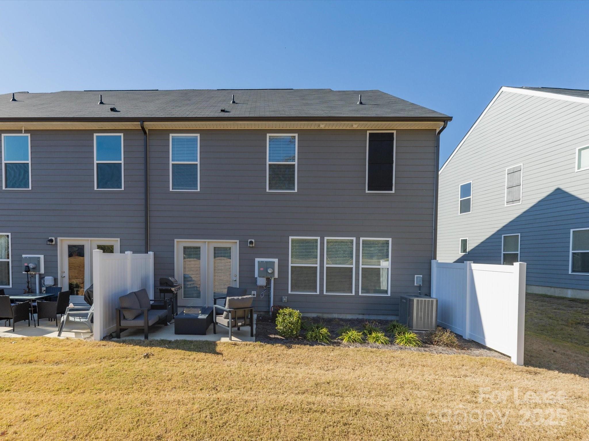 13124 Rover Street Charlotte, NC 28273 - Photo 40 of 46 a view of a house with a yard