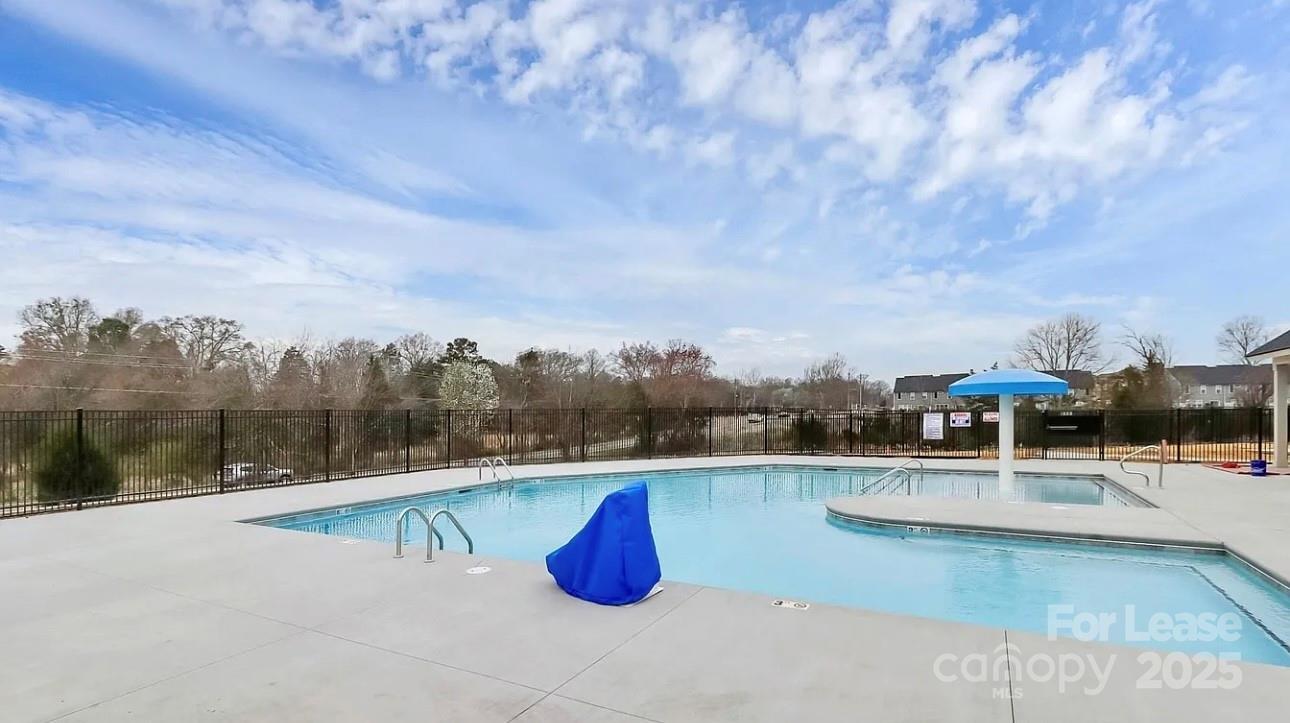 13124 Rover Street Charlotte, NC 28273 - Photo 46 of 46 a view of a swimming pool with a terrace