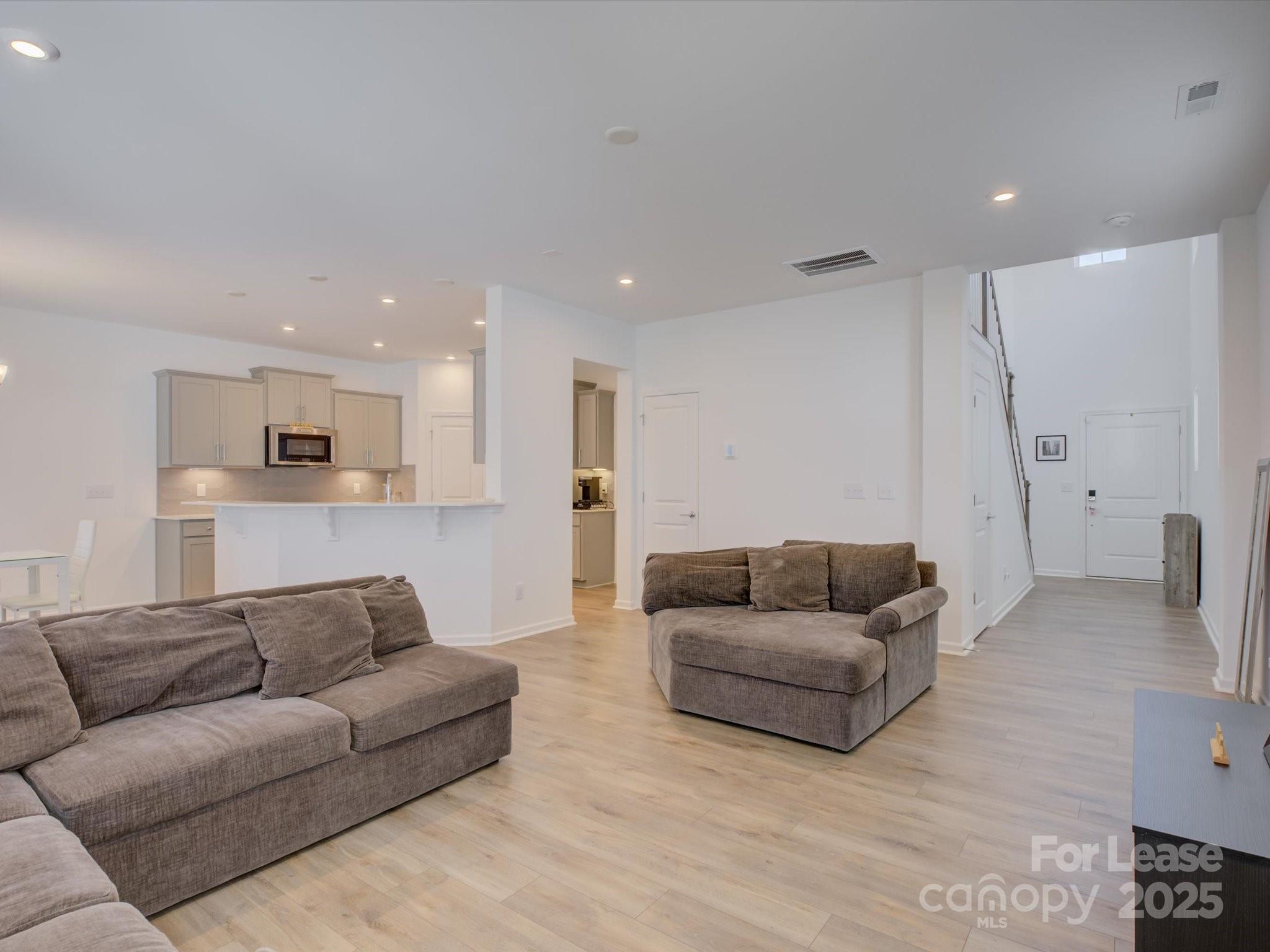 13124 Rover Street Charlotte, NC 28273 - Photo 6 of 46 a living room with furniture and a couch