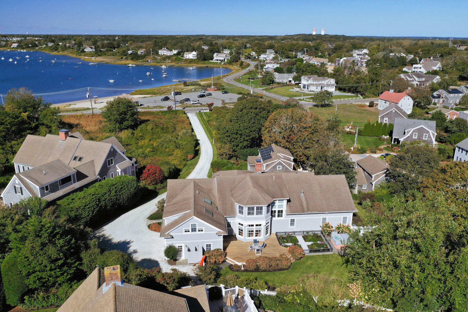 71 Stage Harbor Road Chatham, MA 02633 - Photo 1 of 59 an aerial view of residential houses with outdoor space and swimming pool