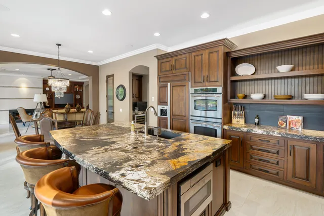 a view of a dining room with furniture large windows and wooden floor