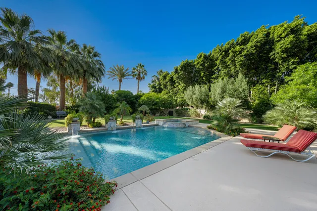 a view of a table and chairs in the garden