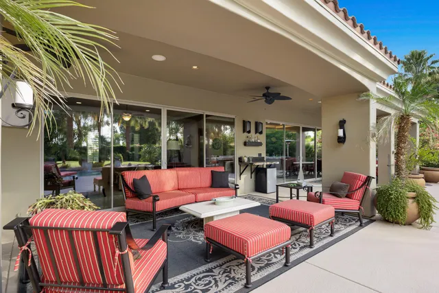 an aerial view of a house with swimming pool garden and patio