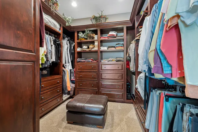 a view of a livingroom with furniture and a window