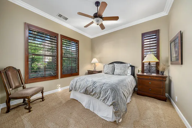 a view of patio with table and chairs under an umbrella