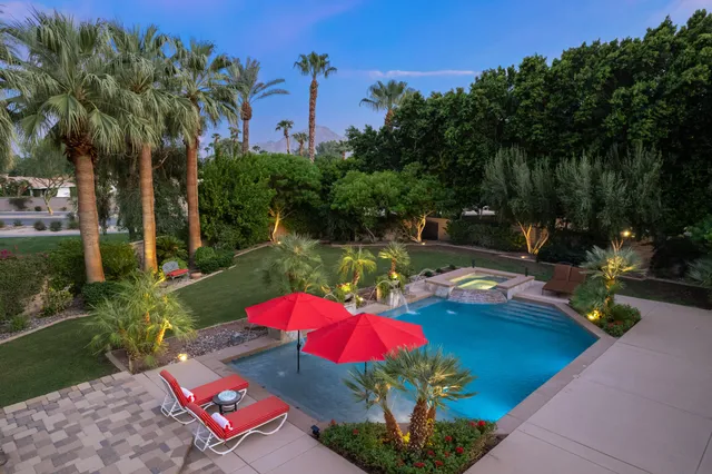 a kitchen with stainless steel appliances granite countertop a stove and a refrigerator