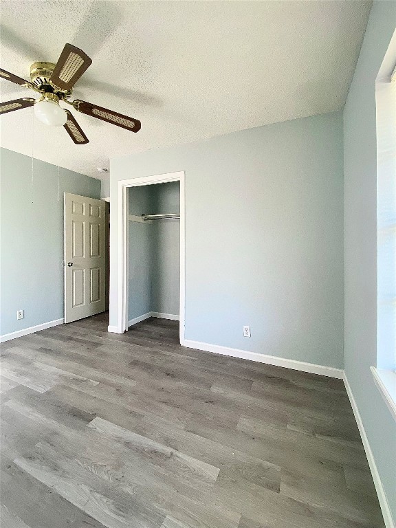 8602 Colonial Drive Austin, TX 78758 - Photo 11 of 19 an empty room with a ceiling fan and a window