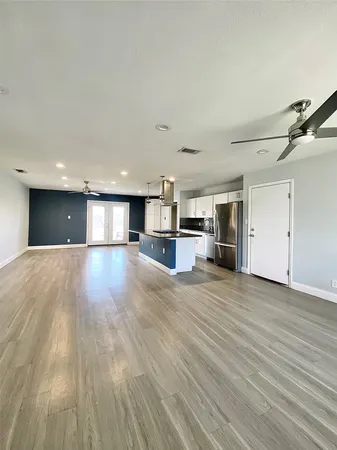a view of a kitchen with a sink and a stove top oven