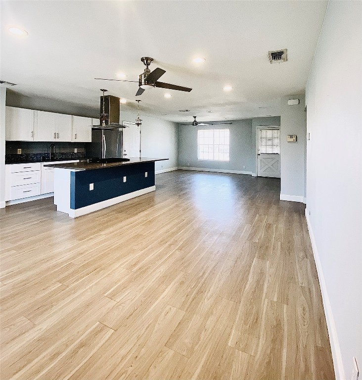 8602 Colonial Drive Austin, TX 78758 - Photo 5 of 19 a view of kitchen with cabinets and wooden floor
