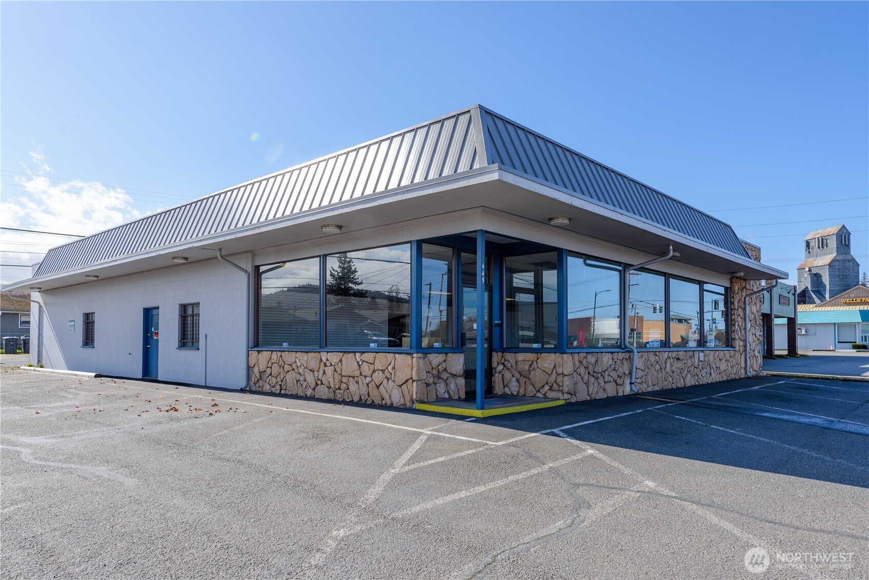 445 West Washington Street Sequim, WA 98382 - Photo 1 of 27 a front view of a house with a garden