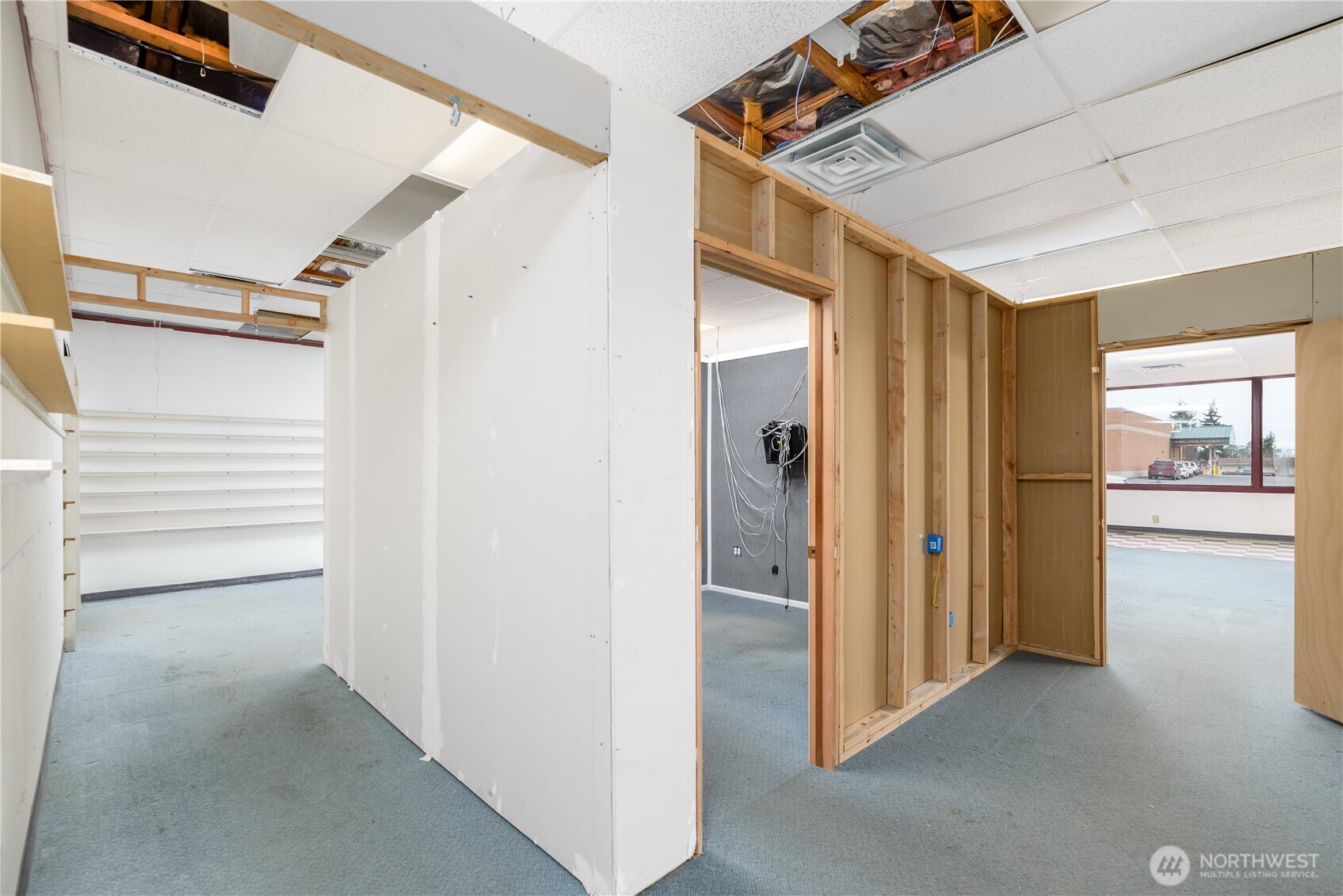445 West Washington Street Sequim, WA 98382 - Photo 12 of 27 a view of hallway with stairs and wooden floor