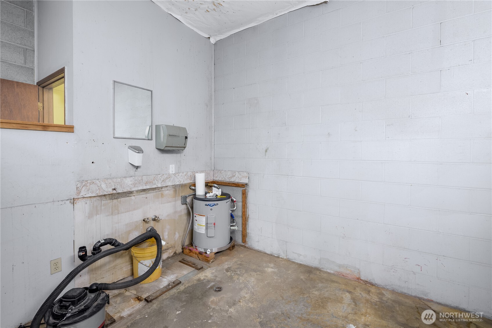 445 West Washington Street Sequim, WA 98382 - Photo 19 of 27 a storage room with cabinets