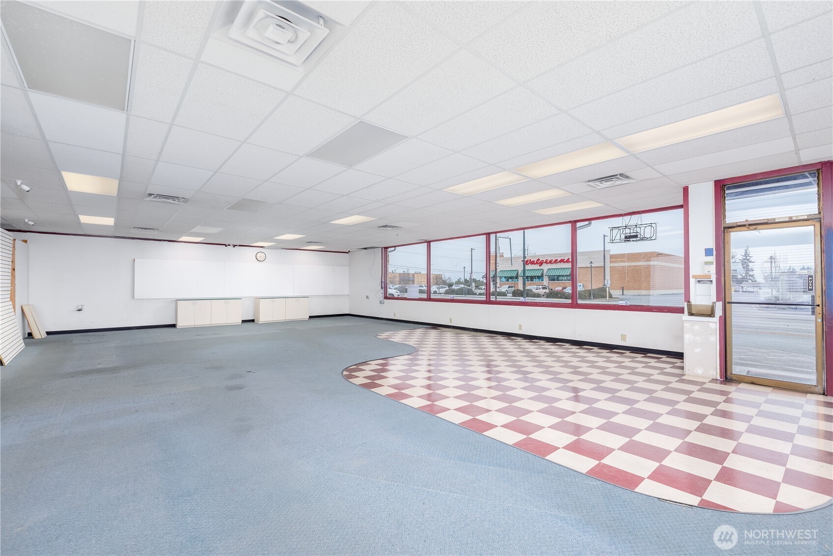 445 West Washington Street Sequim, WA 98382 - Photo 4 of 27 a view of an empty room with a window