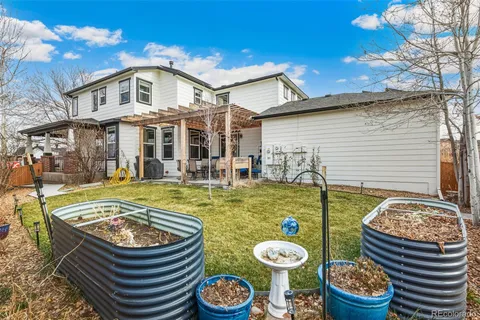 a front view of house with swimming pool and patio