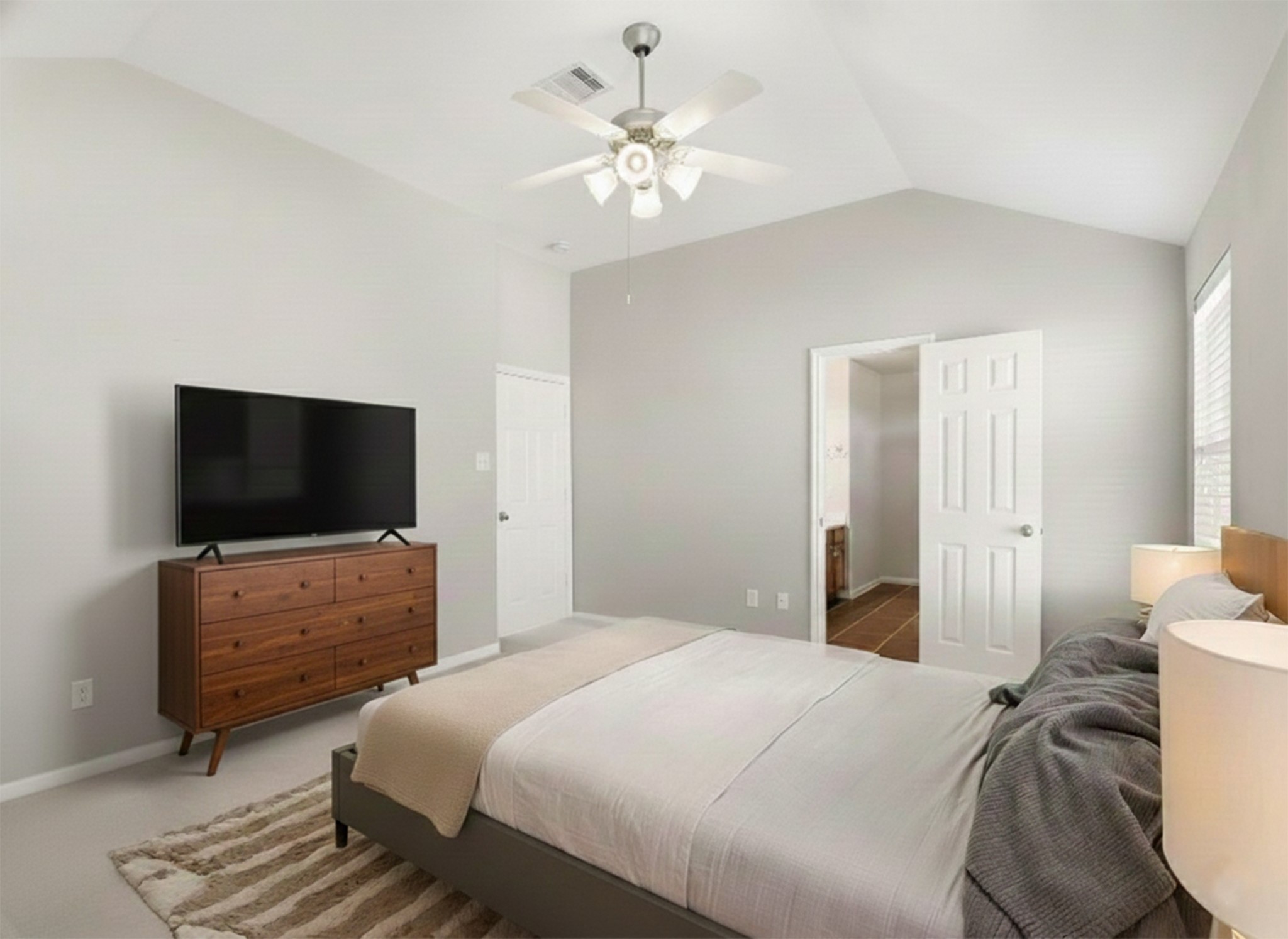 3214 Vinca Ranch Drive Katy, TX 77494 - Photo 12 of 26 Another view of the primary bedroom showing entry to the en suite bathroom and closet area. **Virtually Staged**