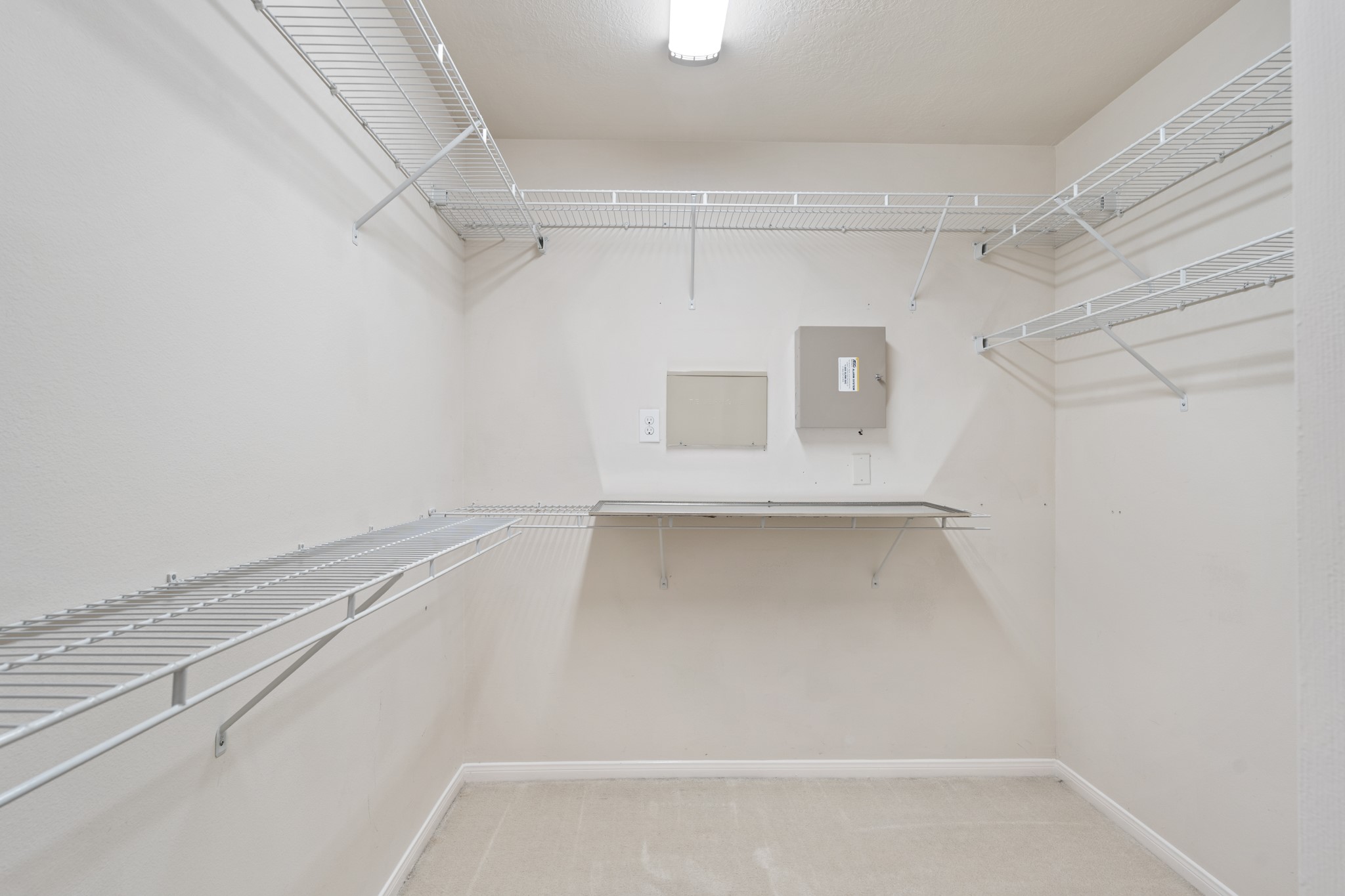 3214 Vinca Ranch Drive Katy, TX 77494 - Photo 15 of 26 Large walk-in closet with built-in shelving and ample hanging space.