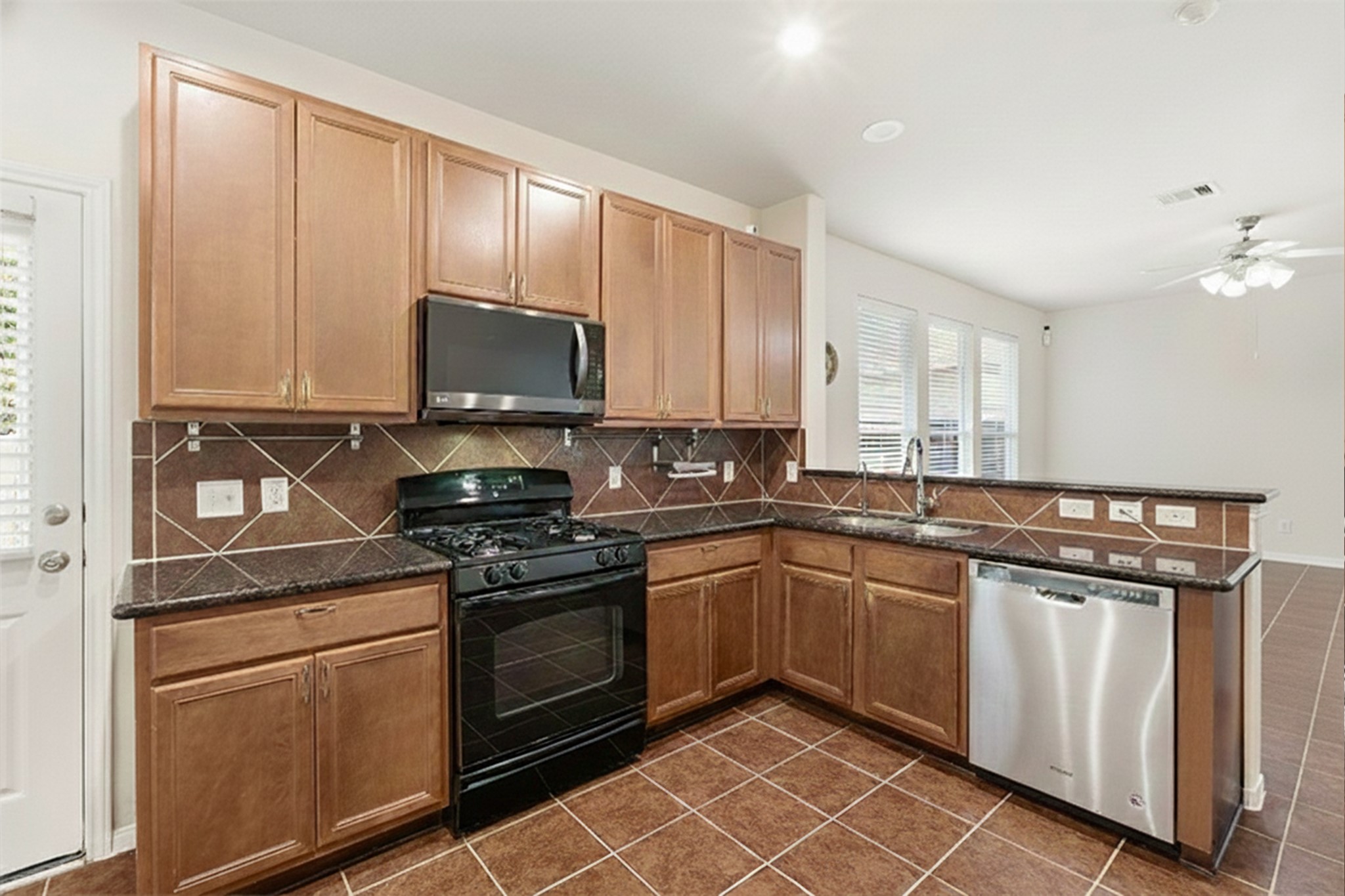 3214 Vinca Ranch Drive Katy, TX 77494 - Photo 7 of 26 Another view of the kitchen area overlooking the family room.