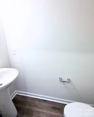 a bathroom with a toilet and a sink