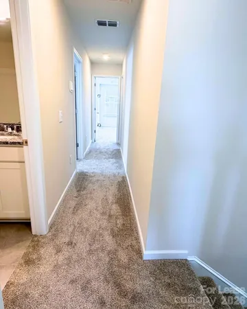 an entryway door with wooden floor