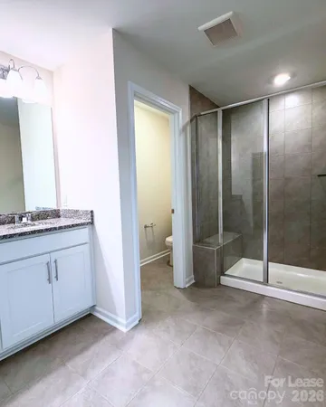 a view of a bathroom with mirror