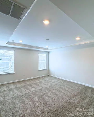 an empty room with a empty space and a window