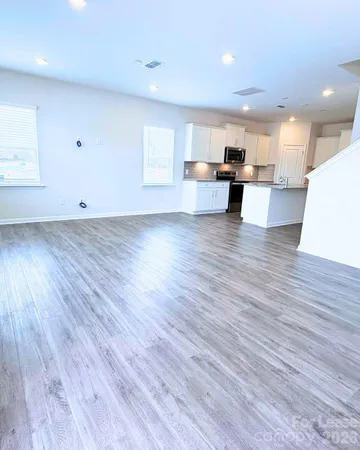a view of kitchen with wooden floors and kitchen view