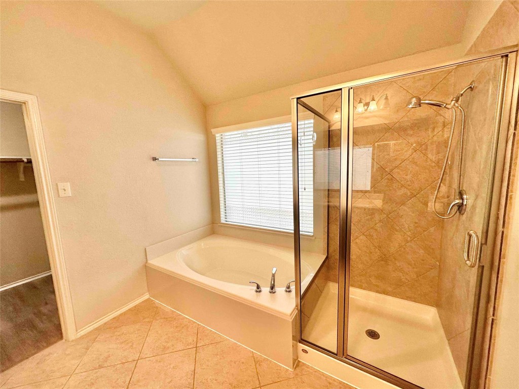 1801 Tall Chief Leander, TX 78641 - Photo 15 of 23 a bathroom with a bathtub and a shower