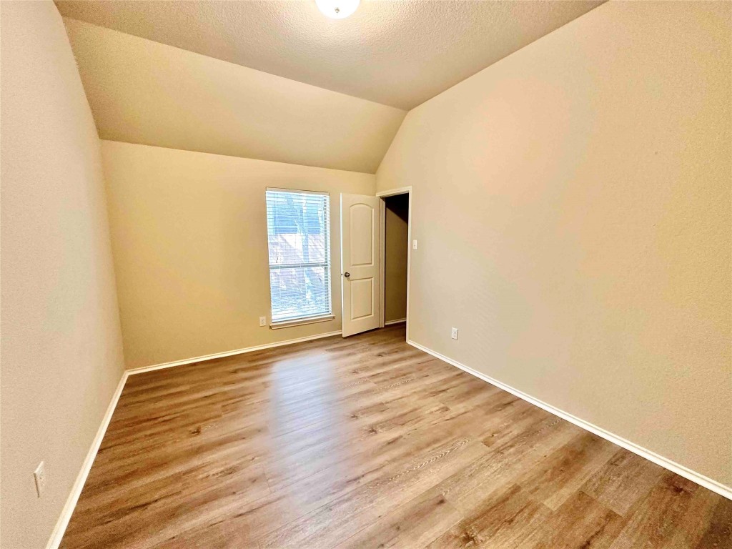 1801 Tall Chief Leander, TX 78641 - Photo 19 of 23 a view of an empty room with wooden floor