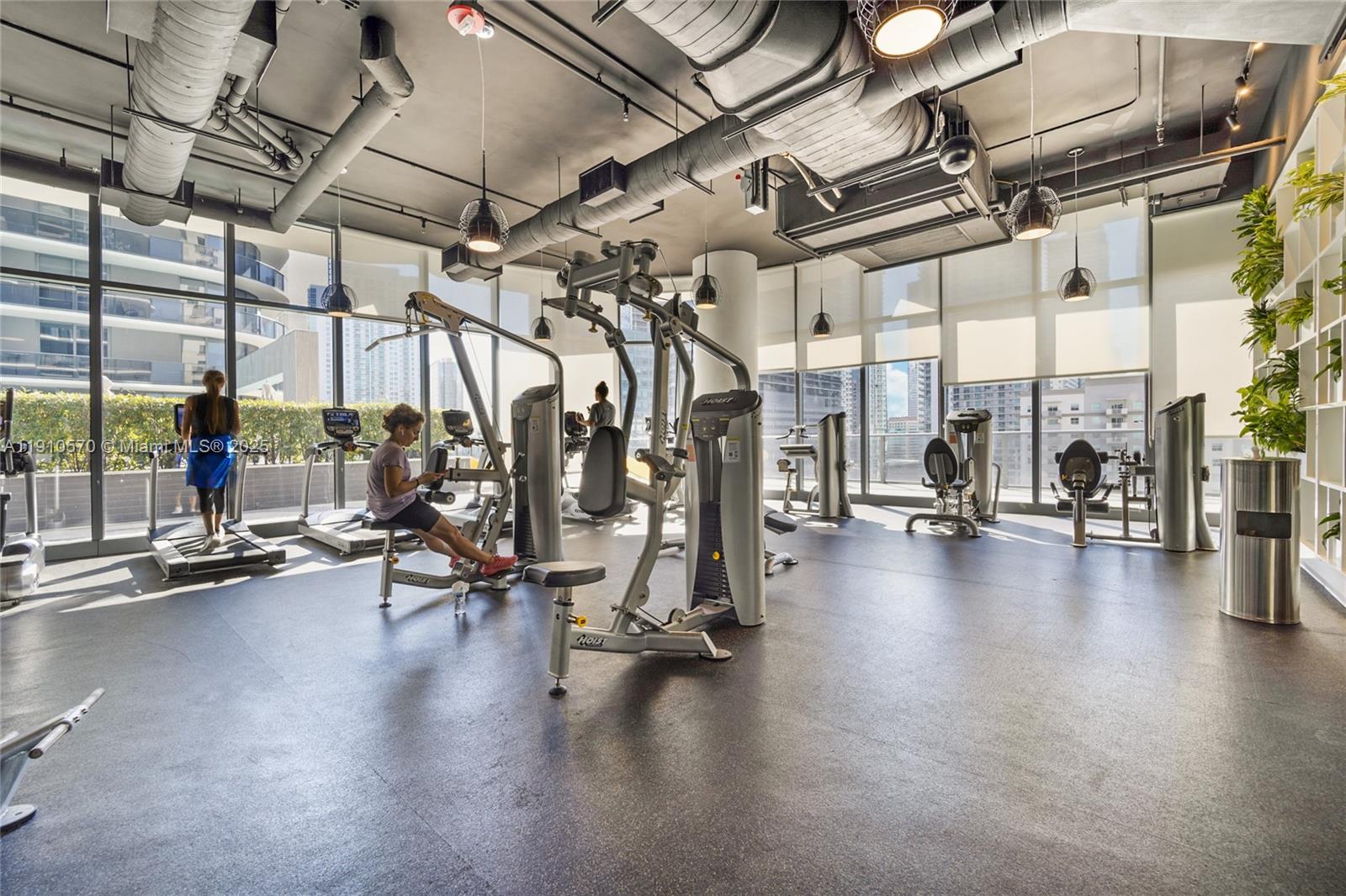 45 Southwest 9th Street, Unit 1904 Miami, FL 33130 - Photo 12 of 15 a view of a room with gym equipment