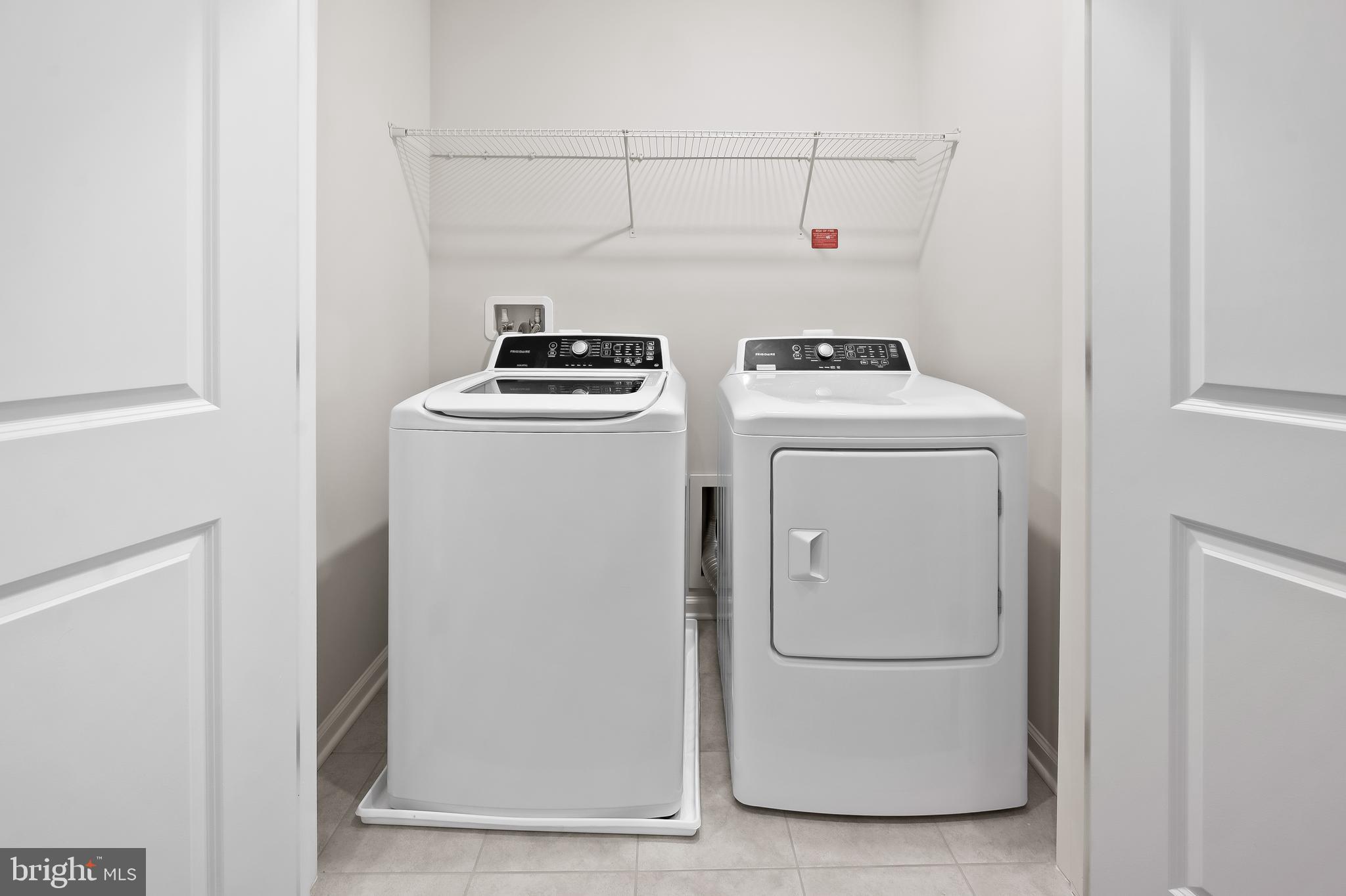 657 Mozart Way Baltimore, MD 21224 - Photo 16 of 39 a utility room with dryer and washer