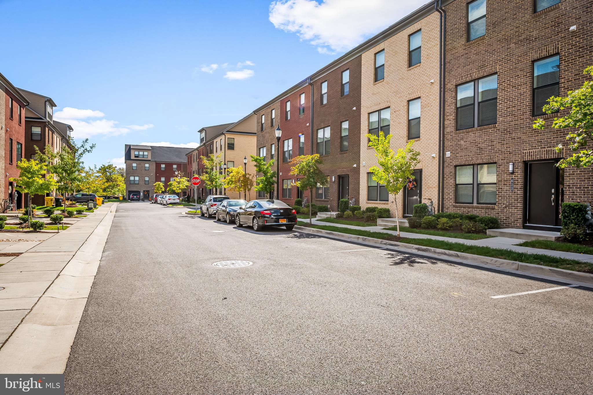 657 Mozart Way Baltimore, MD 21224 - Photo 33 of 39 a view of a street with a building and car parked in front of it