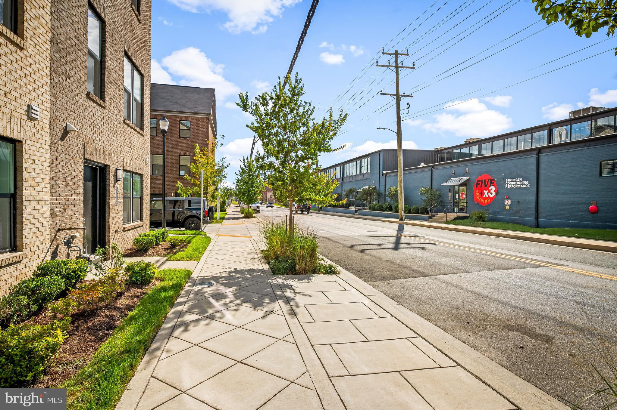 657 Mozart Way Baltimore, MD 21224 - Photo 37 of 39 a view of a pathway both side of building