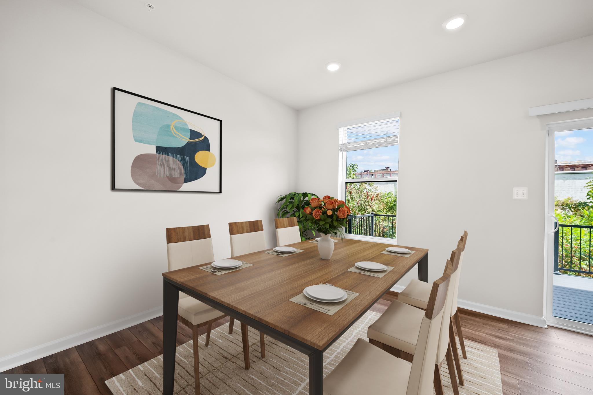 657 Mozart Way Baltimore, MD 21224 - Photo 5 of 39 a view of a dining room with furniture window and wooden floor