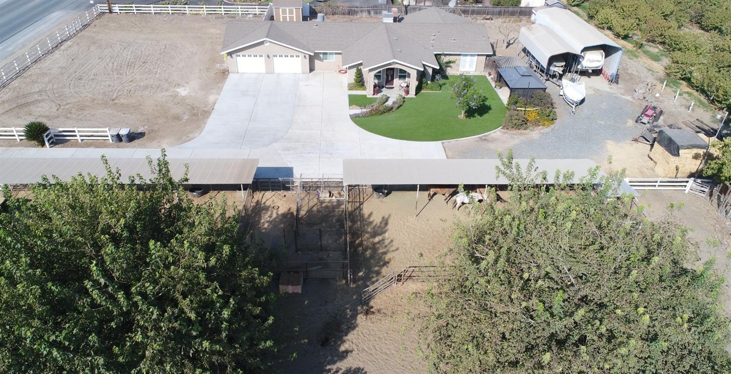 16760 West Hanford Armona Road Lemoore, CA 93245 - Photo 2 of 36 an aerial view of a house with outdoor space and lake view