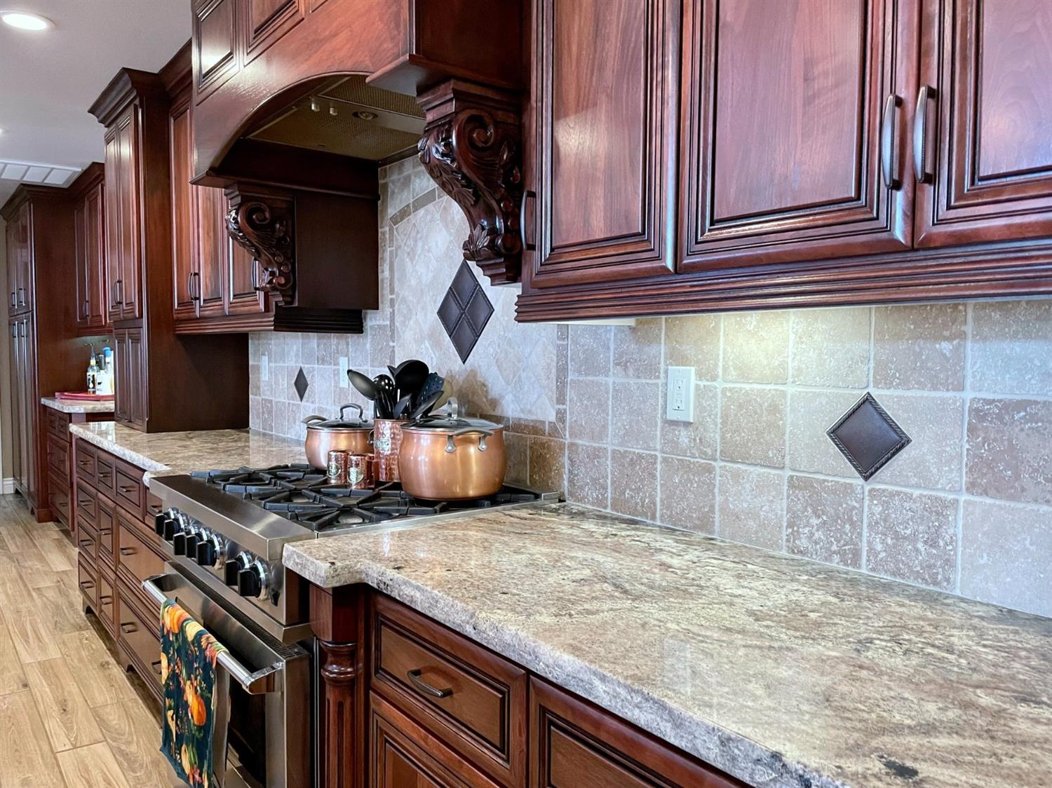 16760 West Hanford Armona Road Lemoore, CA 93245 - Photo 12 of 36 a kitchen with stainless steel appliances granite countertop a stove and a sink